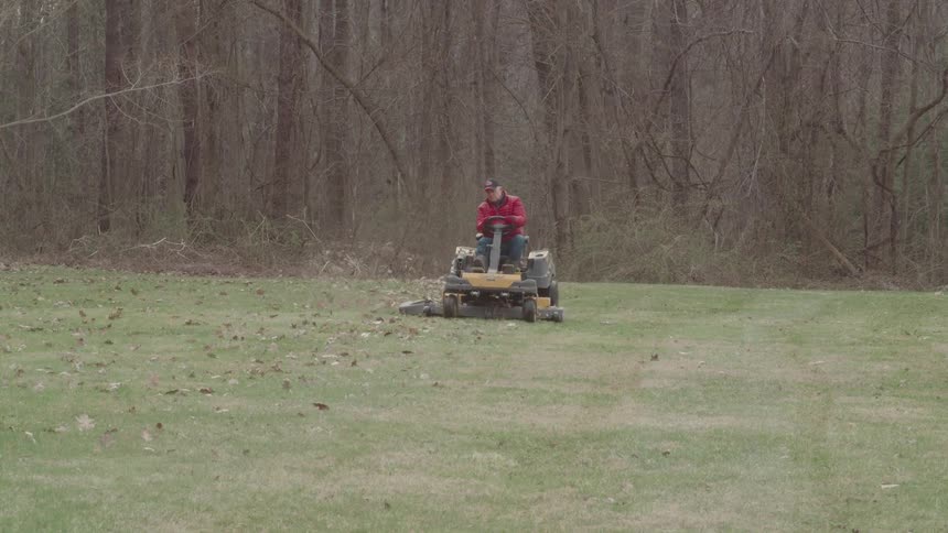 A man mows his lawn