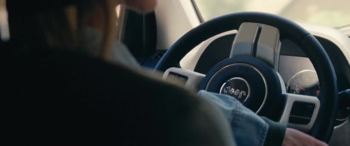 A close up view of someone as they are driving