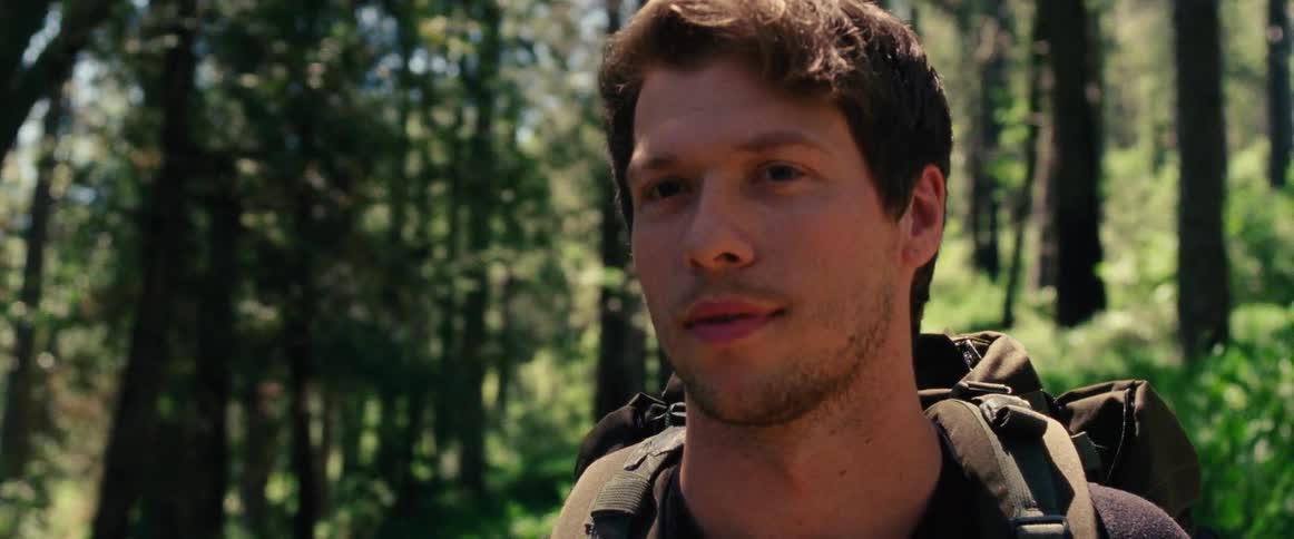 Man smiling in a forest