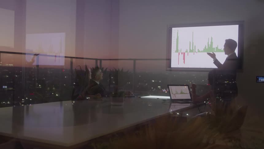 A man is giving a presentation in the conference room