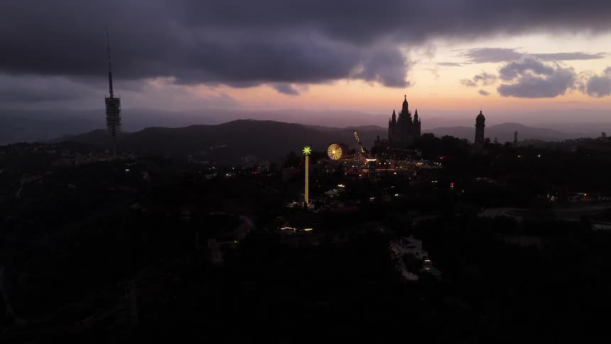 Cityscape at night with dark clouds covering the sky