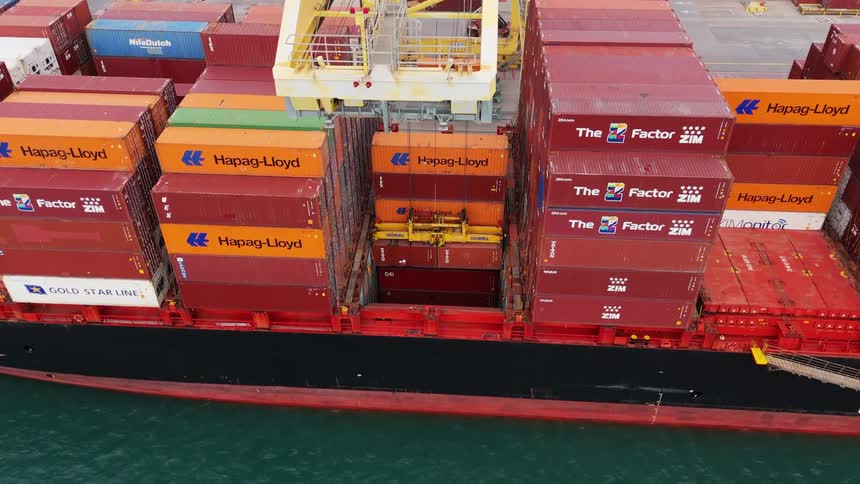 Stacked containers on a cargo ship at the port