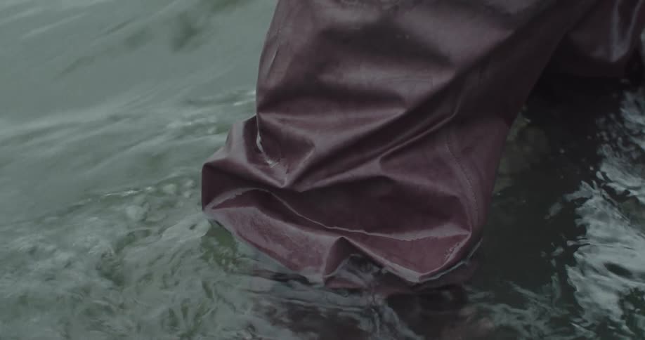 Waterproof pants submerged in a river