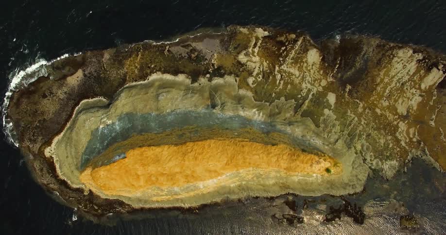 Deep crevice surrounded by water