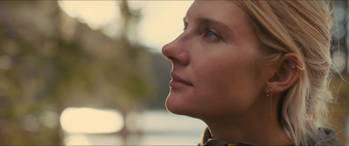 Portrait of a young blonde woman in a natural setting