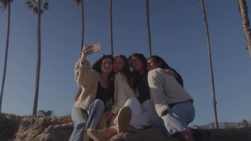 Group of four friends taking a selfie