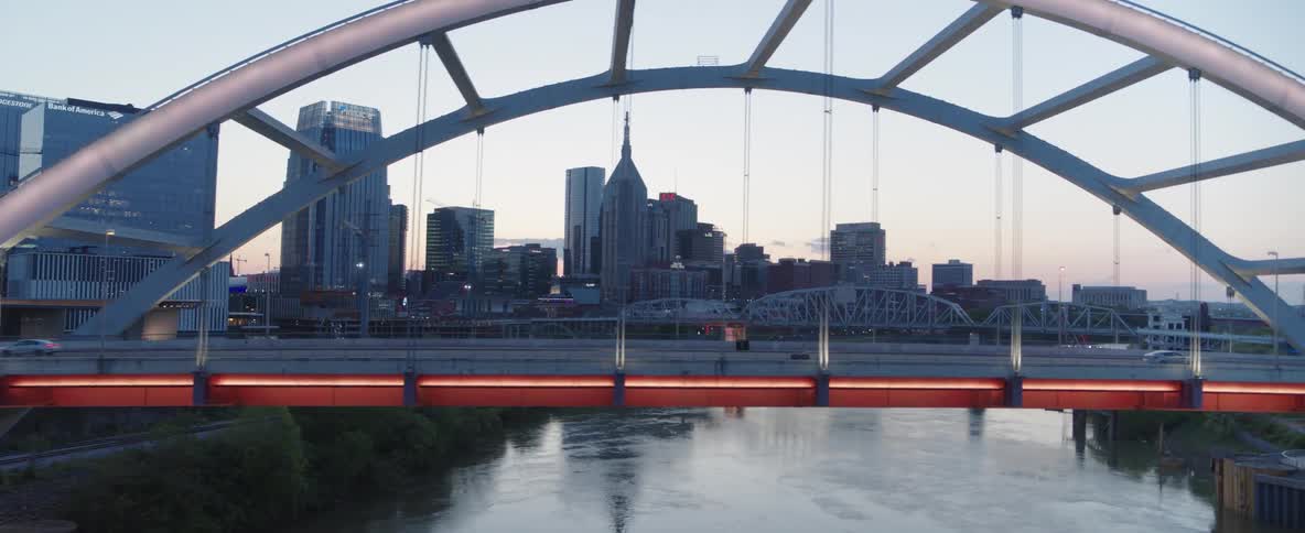 Bridge over the river with vehicle traffic in a modern metropolis