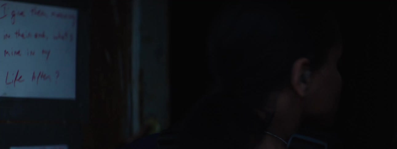 Woman entering a house during a police operation