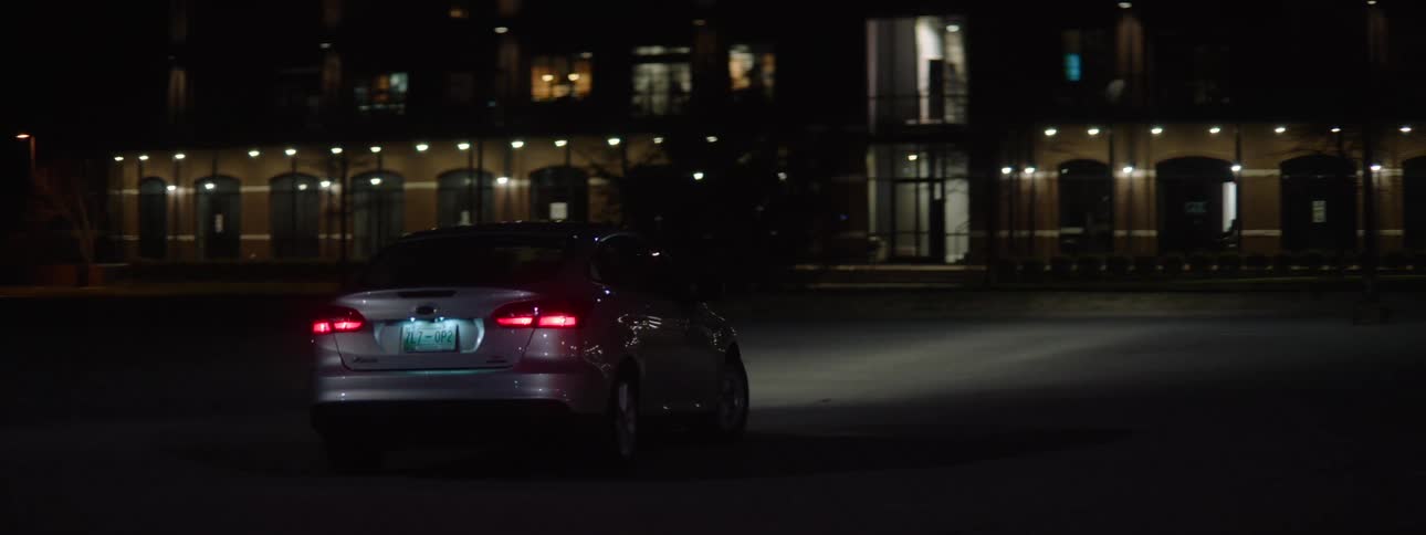 The car pulls out and makes a turn in the city