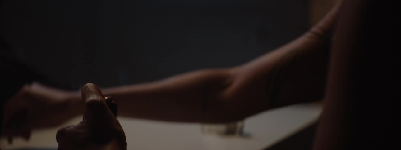 Pair of hands of a person loading a gun