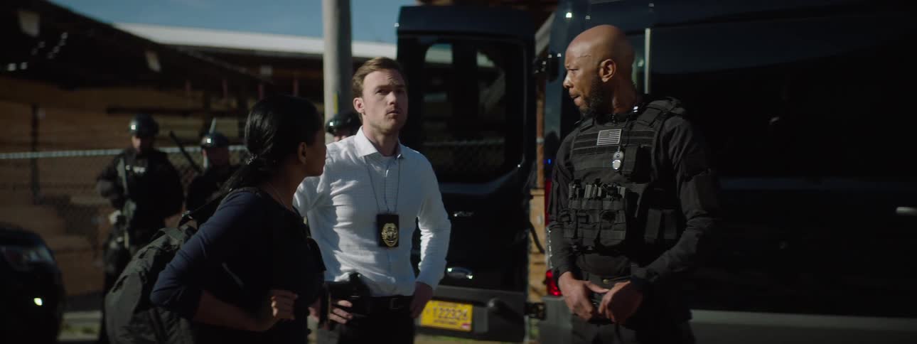Police officers talk together outside