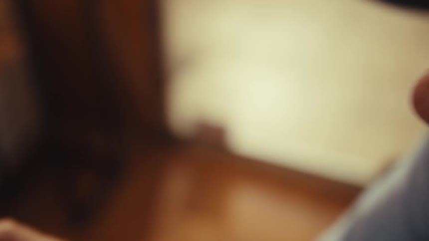 Smiling elderly man using a smartphone