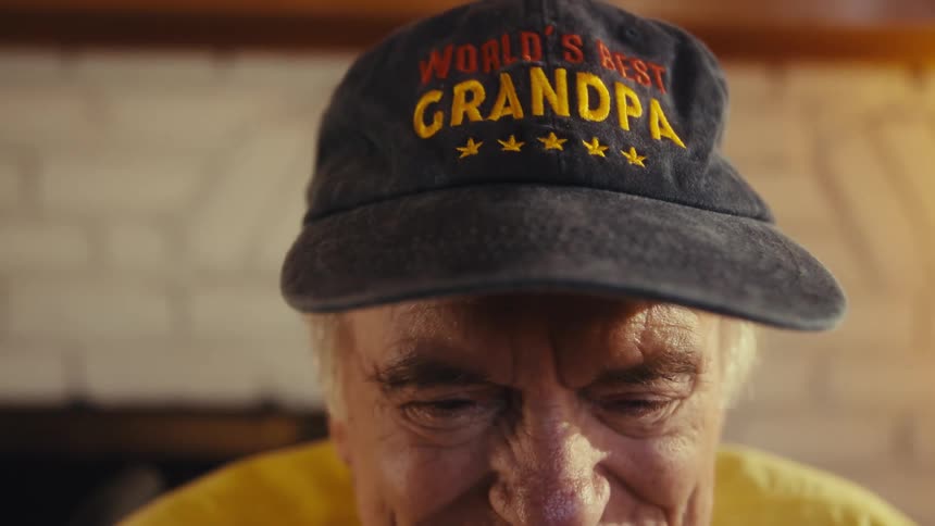 Smiling elderly man in cap