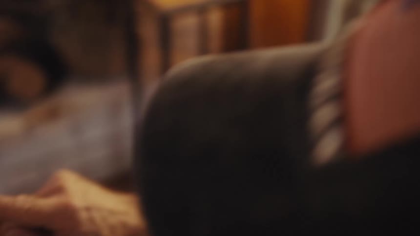 The man taps the screen of his cell phone