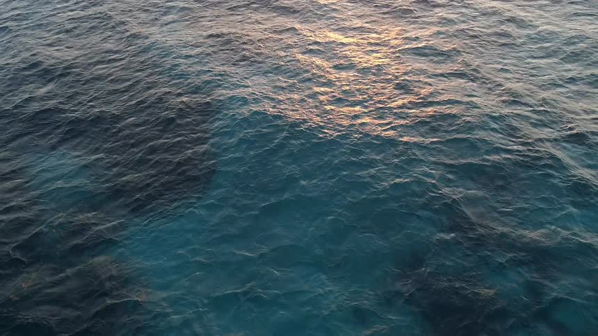 The surface of the ocean moves and reflects light