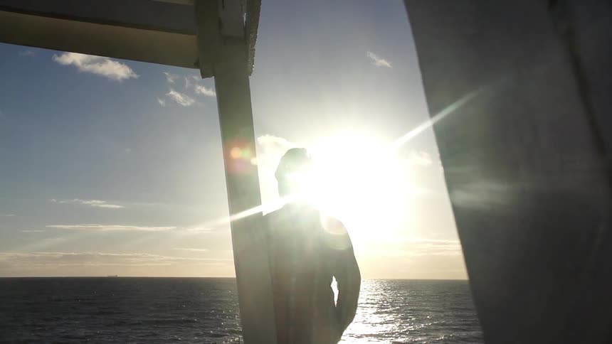 Man watching the ocean during the day