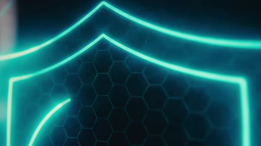 A close view shows a vibrant blue and teal glowing digital graphic with a geometric pattern and hexagons on a dark background