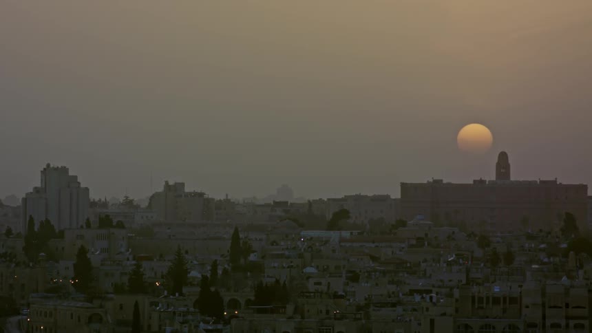 Sun setting upon a city