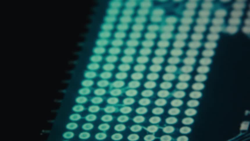 A detailed macro view shows a circuit board with small white leds and a grid of soldered dots on a dark background