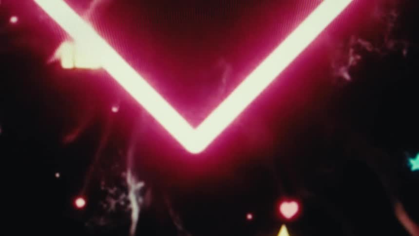 Glowing pink neon heart against a dark background