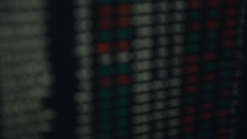 Series of stock market price lists displayed on a computer screen