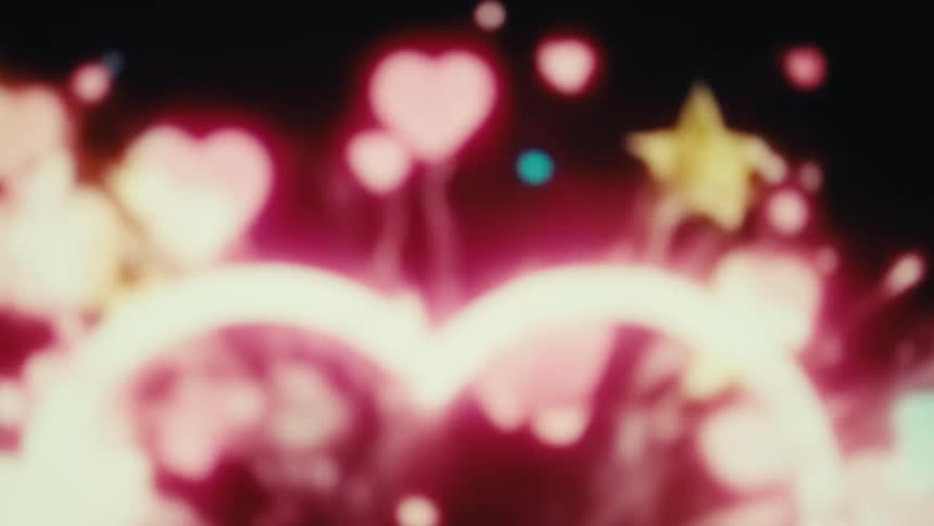 An animation begins with a white line drawing a heart shape against a black background the heart then fills with a vibrant red color and the background explodes with glowing pink hearts and yellow stars