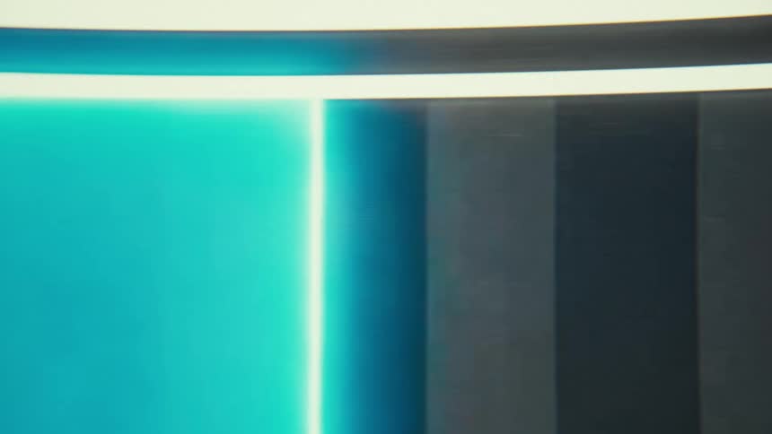 A screen shows a section of light that moves from a dark blue to a light blue and back to a dark blue