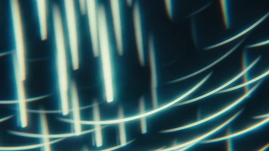 A screen displays glowing light streaks in an abstract digital pattern