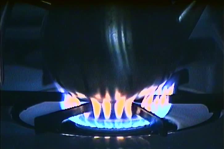 The pot is heating on the stove top