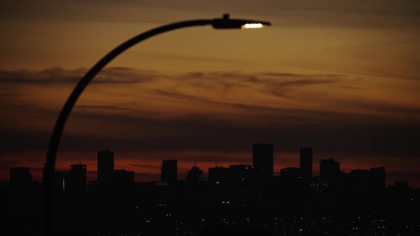 The skyline is in the shade as the sun sets