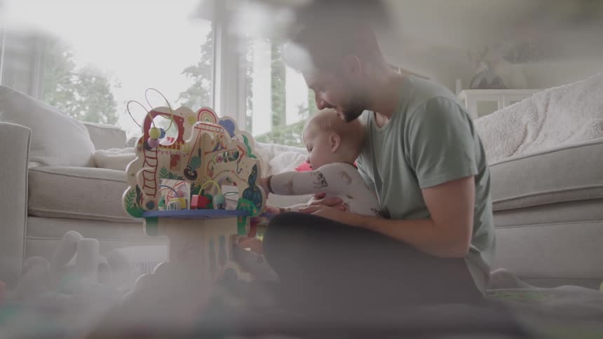 The father plays with his son