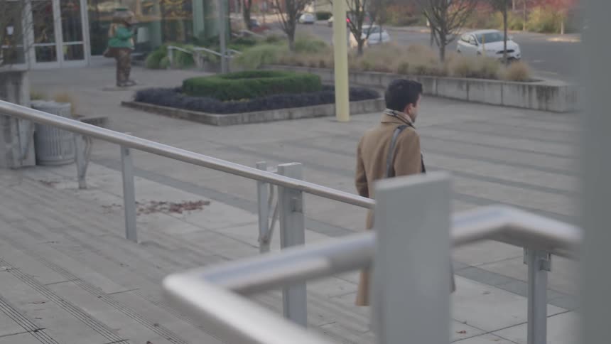 A man walks down some steps