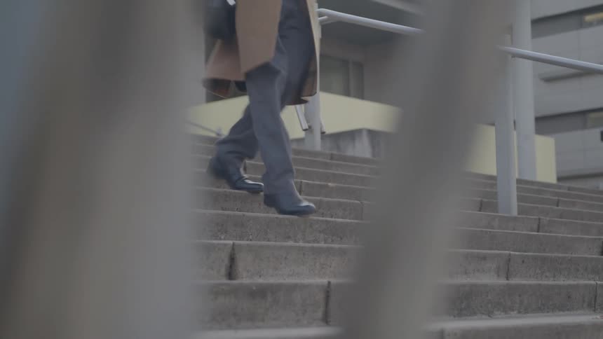 The man descends down the staircase