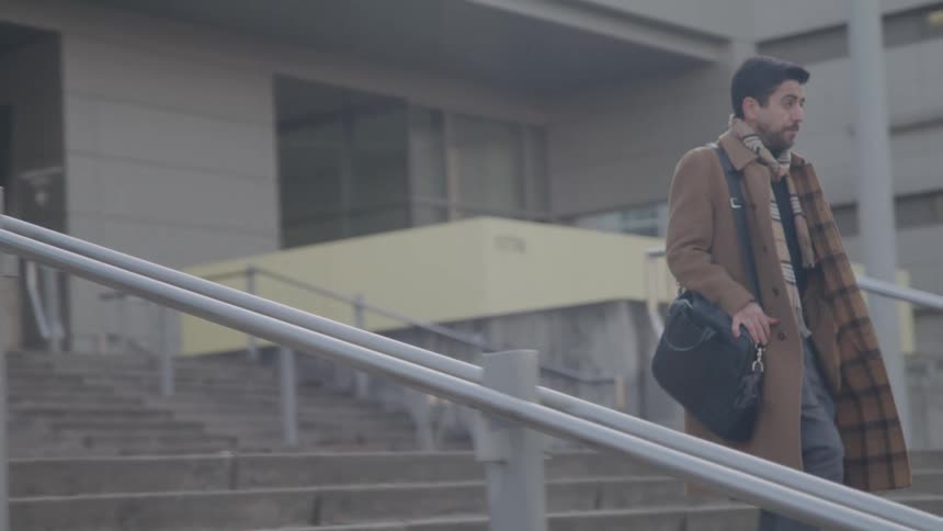 A man walks down some stairs