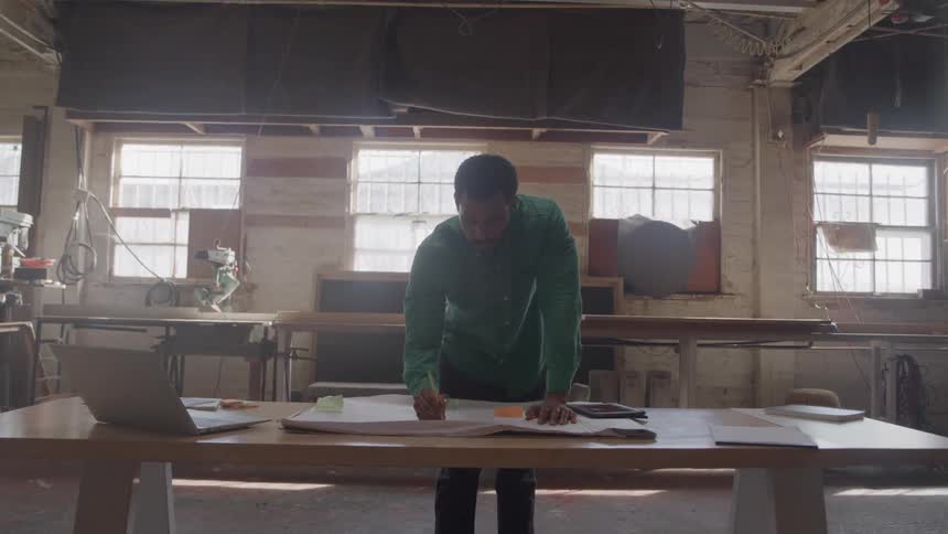 Man drawing a project on the table