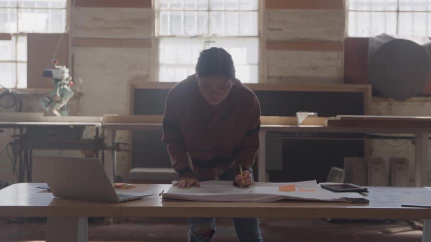 Woman working on a project at a table