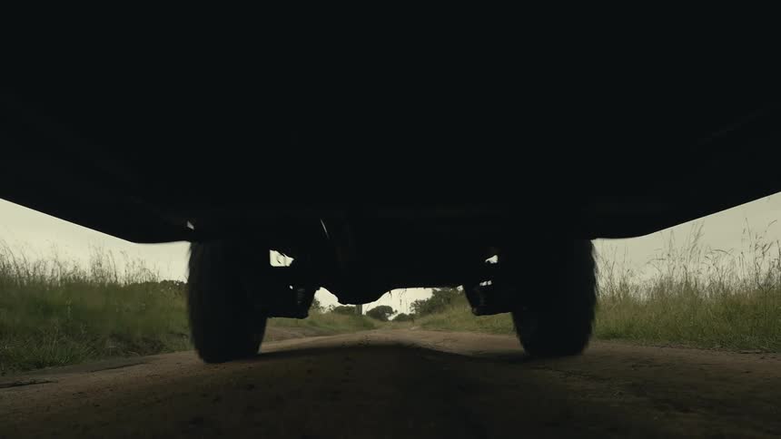 A jeep rides over the camera