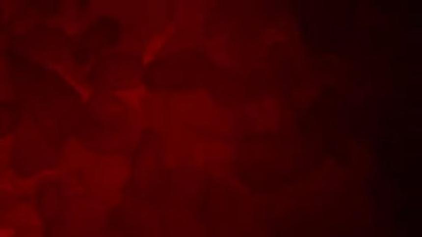 Stone texture in deep red tones resembles glowing minerals