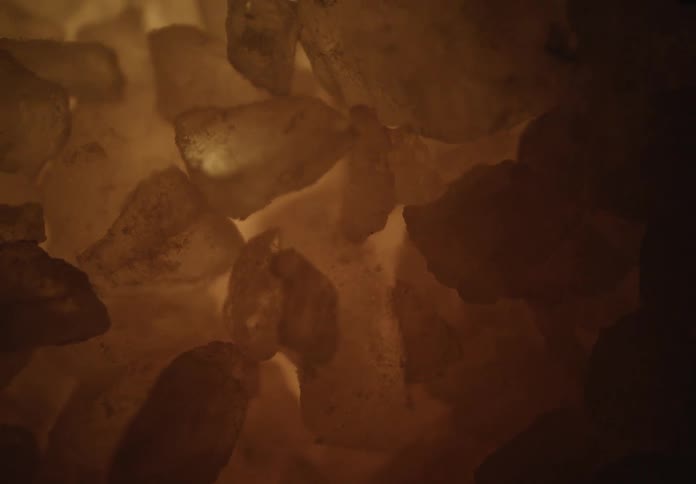 Warm amberhued crystals glow from within their soft light casting a cozy meditative atmosphere