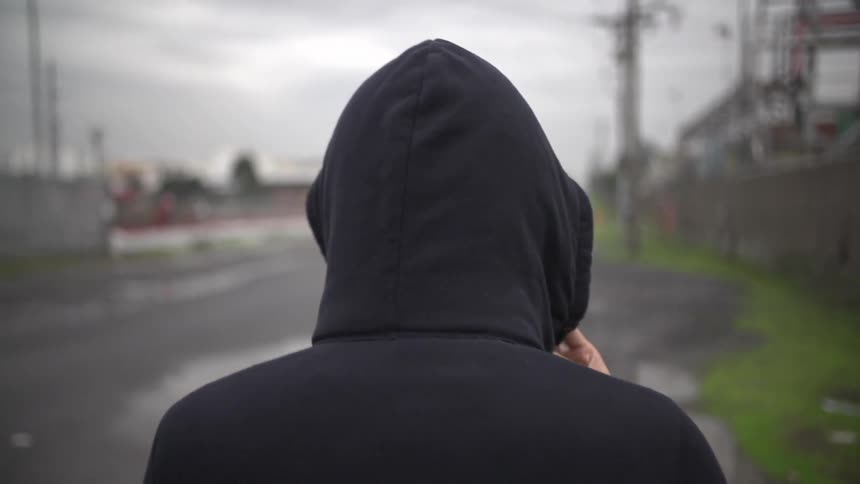 The person walks on the road