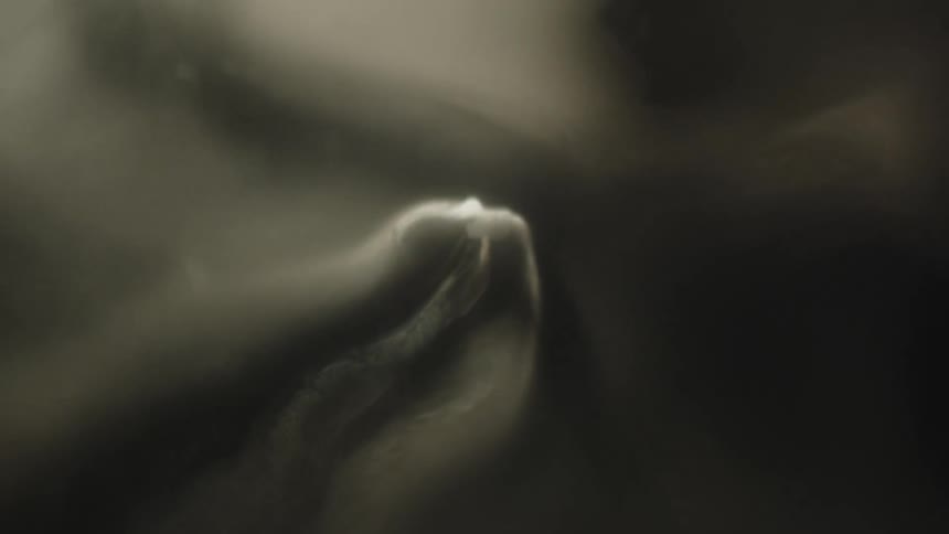 Abstract object moving through smoke