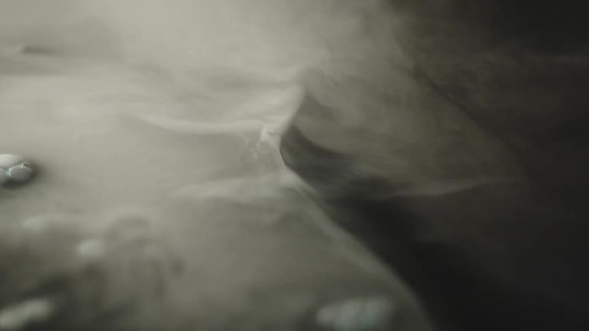 Abstract formation of light smoke blends with dark shadows
