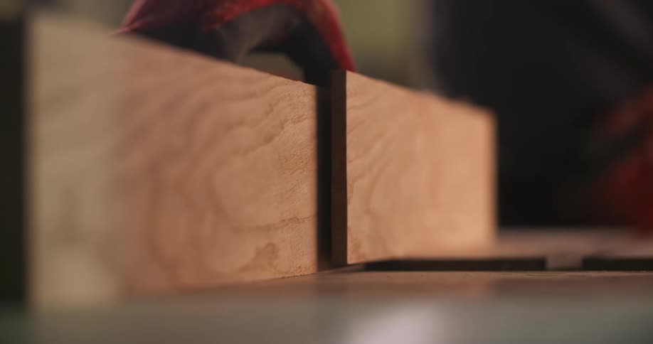 Wood piece with a precise cut is positioned on a work surface