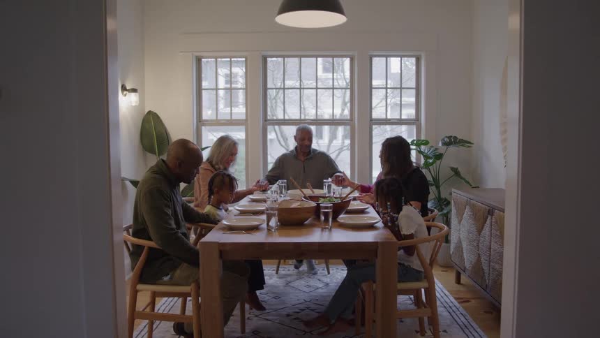 A family eats at the dinner table