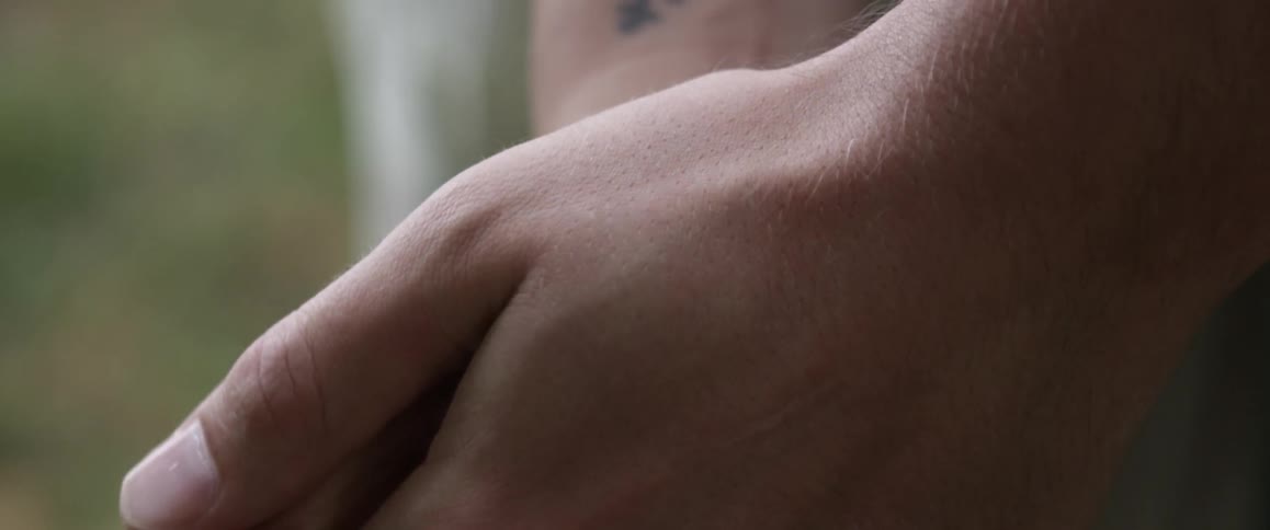 A man and woman hold hands