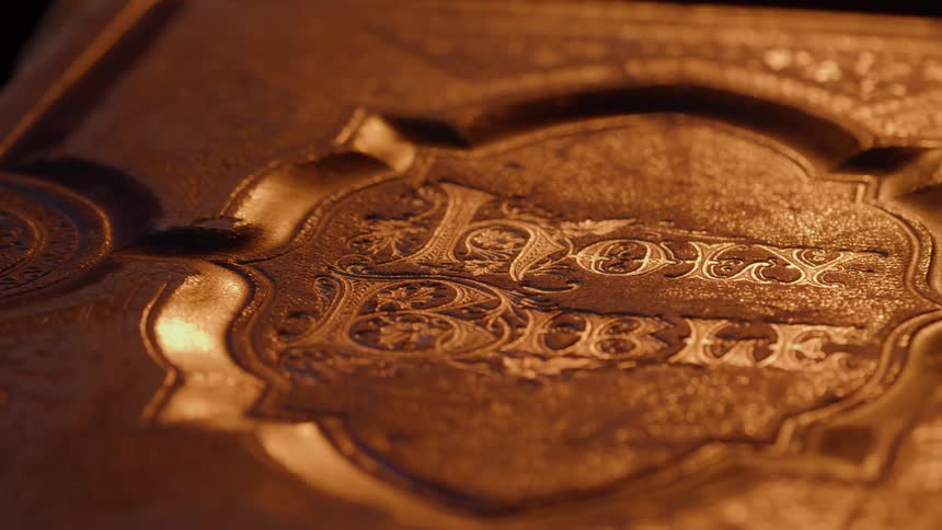 Embossed golden cover of an old bible with ornate details