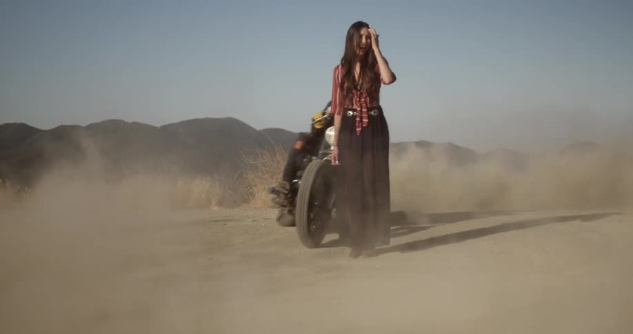 Motorcycle burnout on a dirt road