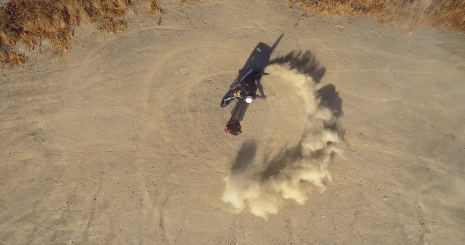 Aerial view of motorcycle spinout in dirt