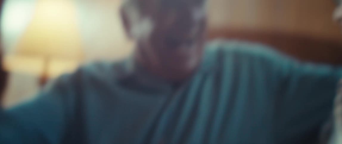 Elderly couple hugging and sharing a loving gaze