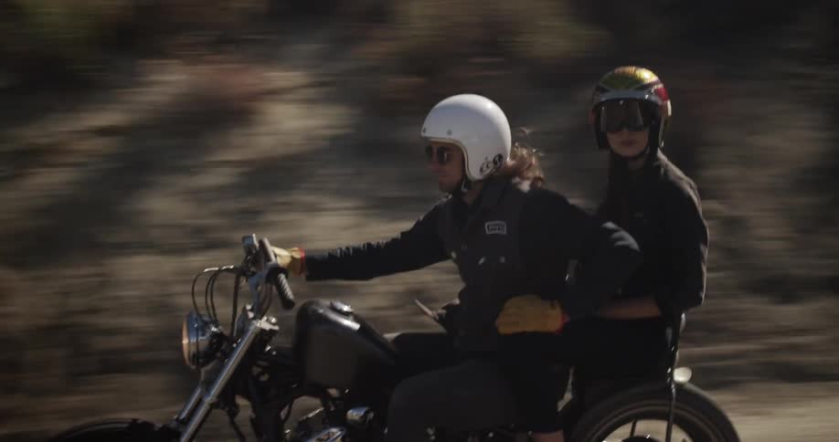 Man and woman riding a motorcycle